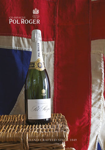 Sybarite Cellars Trade - A bottle of Pol Roger champagne displayed on wicker basket in front of a British Union Jack flag.