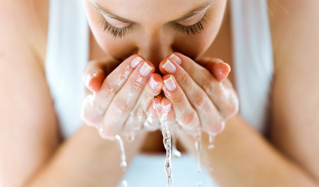 washing face with water