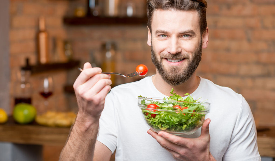 bearded man eating salad