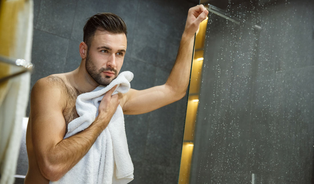 man drying off after shower