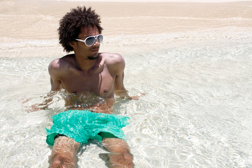 man enjoying tropical beach waters