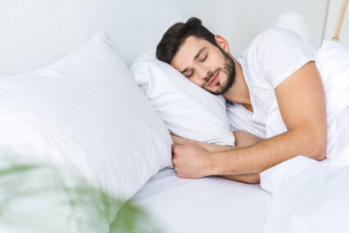 man sleeping in bed