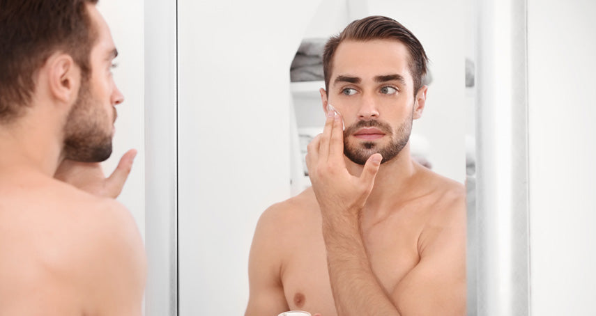 man using facial cream