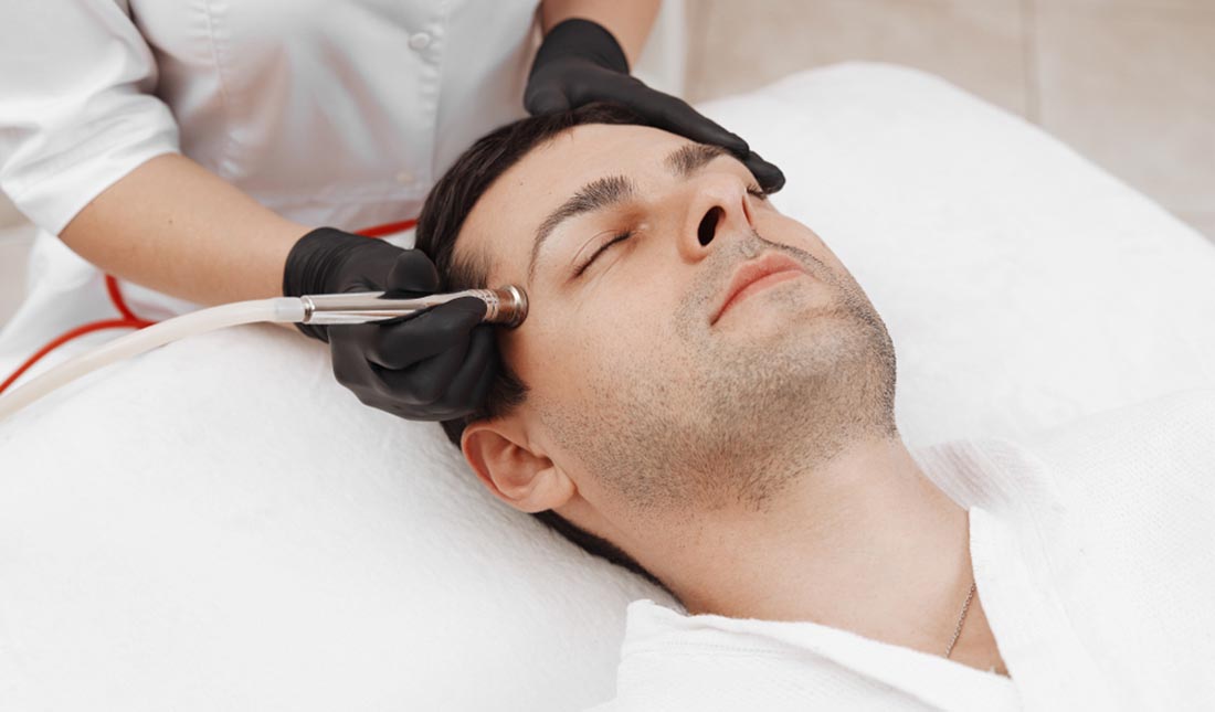 man getting facial dermabrasion