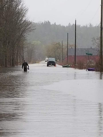 man walking in flood ottawa river