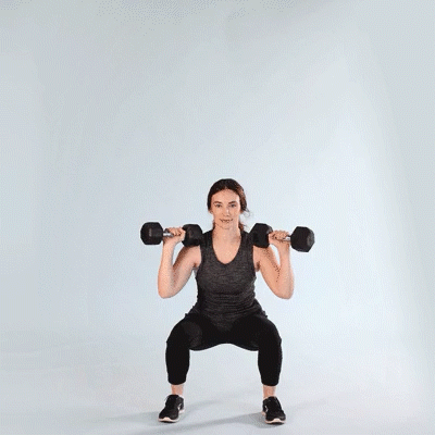 A woman doing a Dumbbell Thruster Exercise