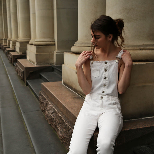 Woman in white jumpsuit