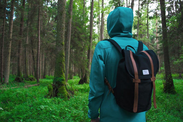 Man with a backpack in a forest