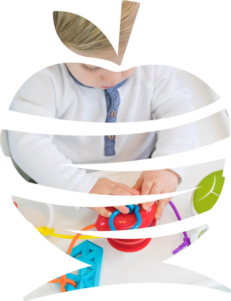 The Grapple<sup>®</sup> toy tether is an apple-shaped, adjustable toy holder that suctions to any smooth surface and holds your baby’s favorite toys with silicone straps.