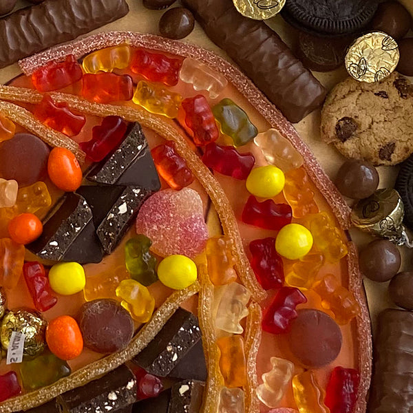 Colorful Candies and Chocolates arranged in a tray 