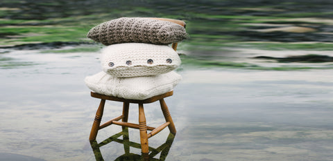 Cushions knitted in Puddle by The Knitter's Yarn