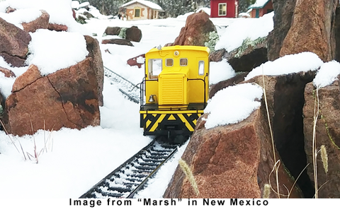 38501 Clean Machine is working away on a snow covered layout in New Mexico