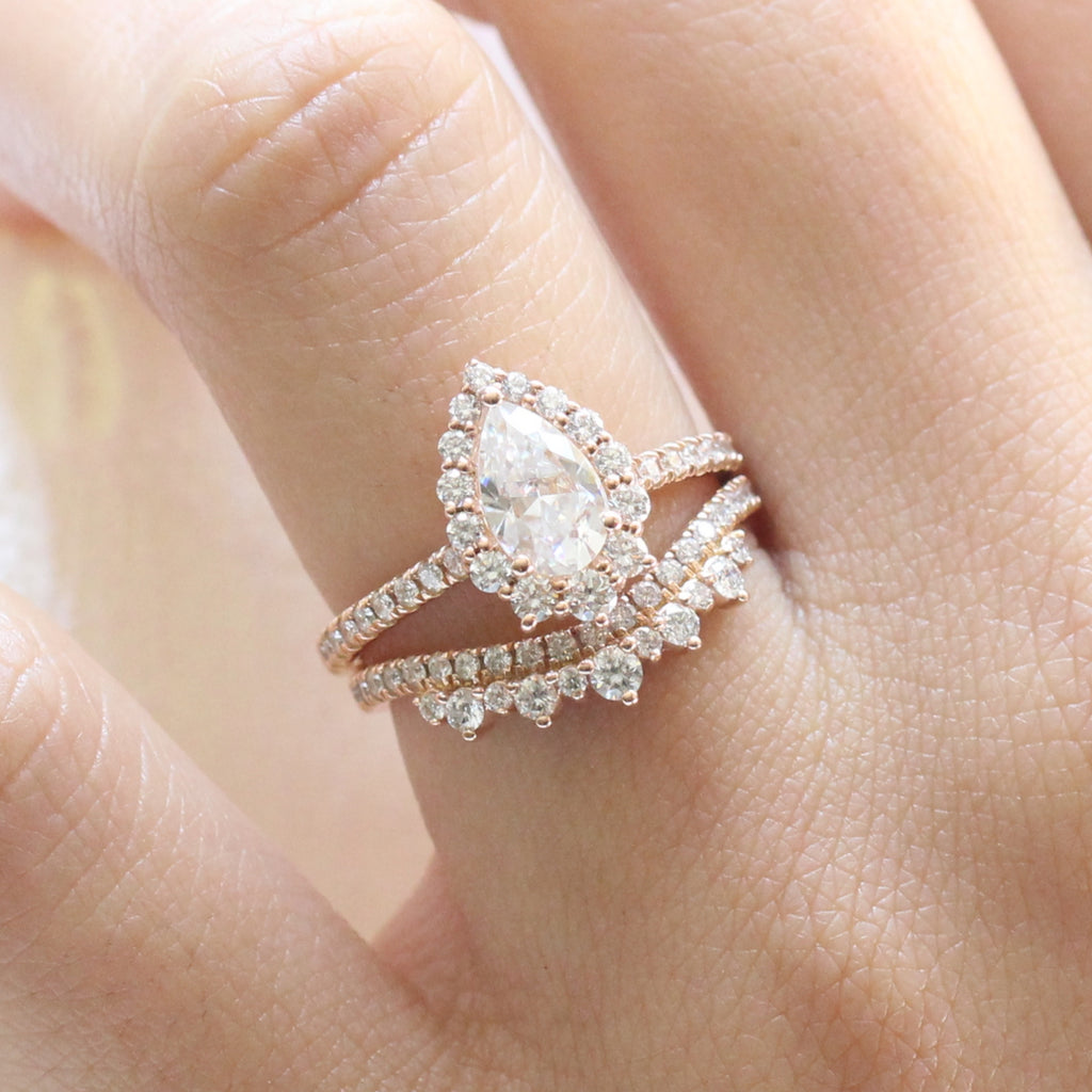 pear moissanite engagement ring rose gold and curved crown diamond wedding band by la more design jewelry