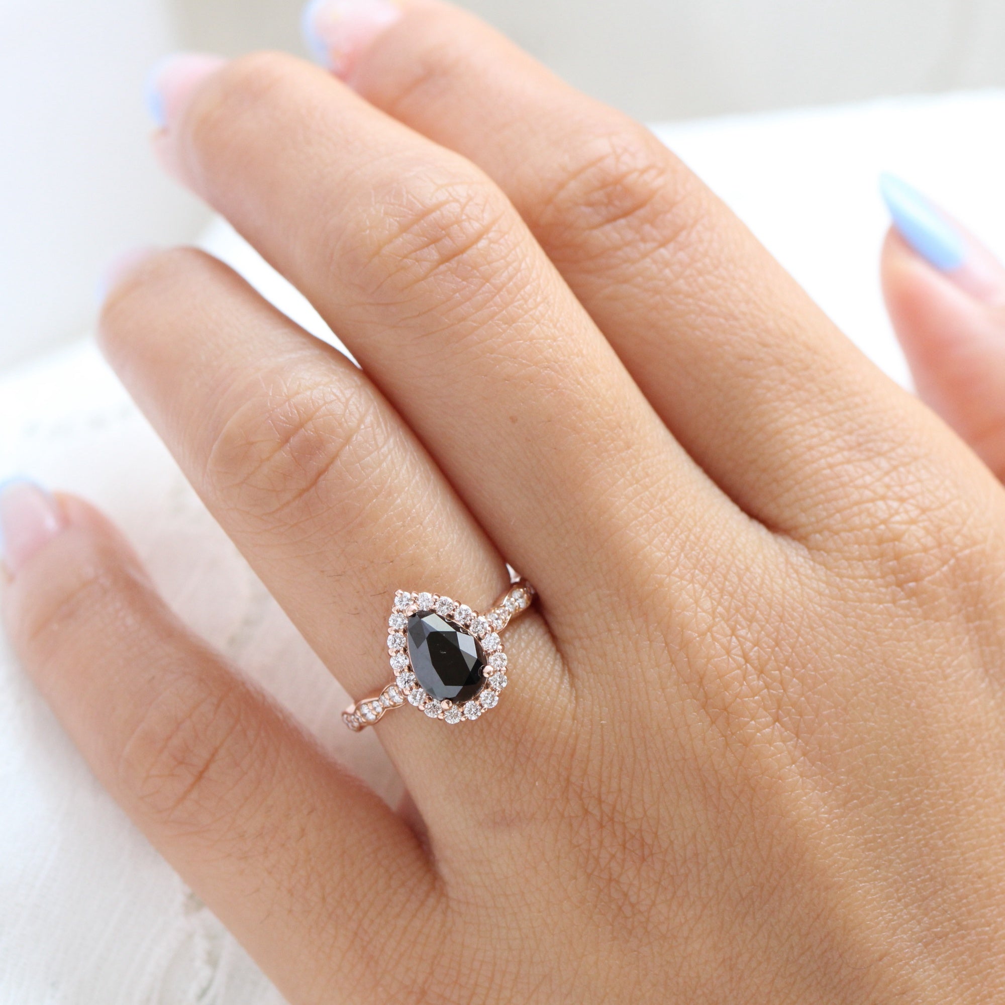 pear shaped black diamond engagement ring