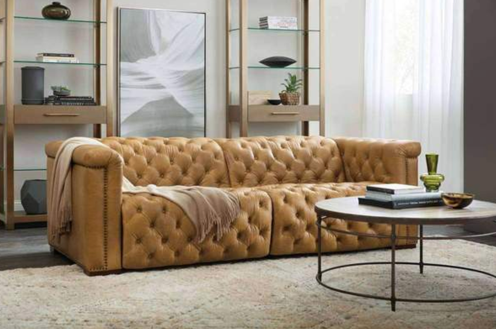 brown leather sofa with blanket
