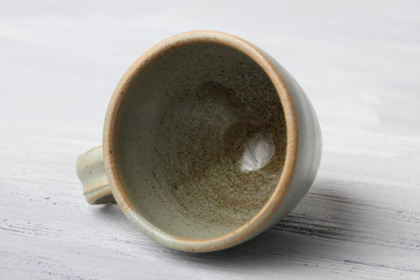 Turquoise pottery glaze on espresso cup