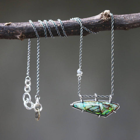 opal pendant necklace in silver braided chain