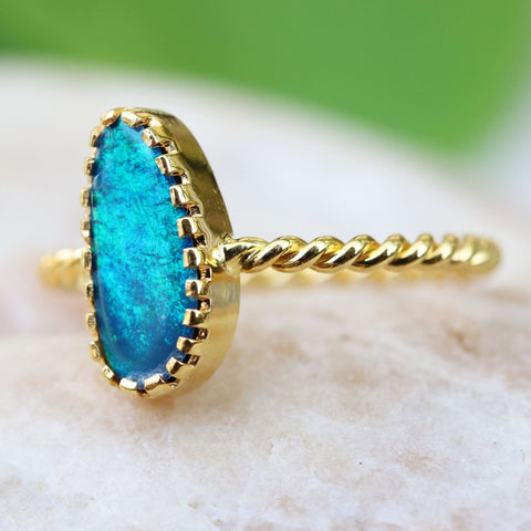 gold ring with blue Australian opal in unique crown setting from Thailand