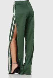 green track pants with white stripe