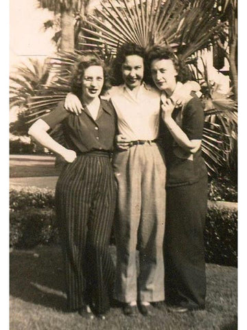 Women wearing high waist wide leg trousers in 1940s