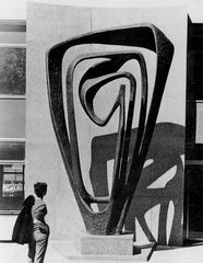 Barbara Hepworth in front one of her sculptures
