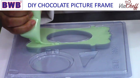 Filling the picture frame chocolate mold