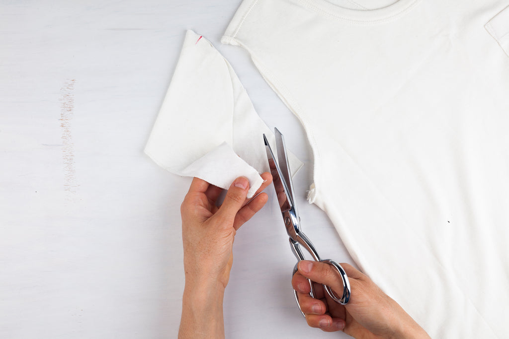 removing sleeve from white shirt