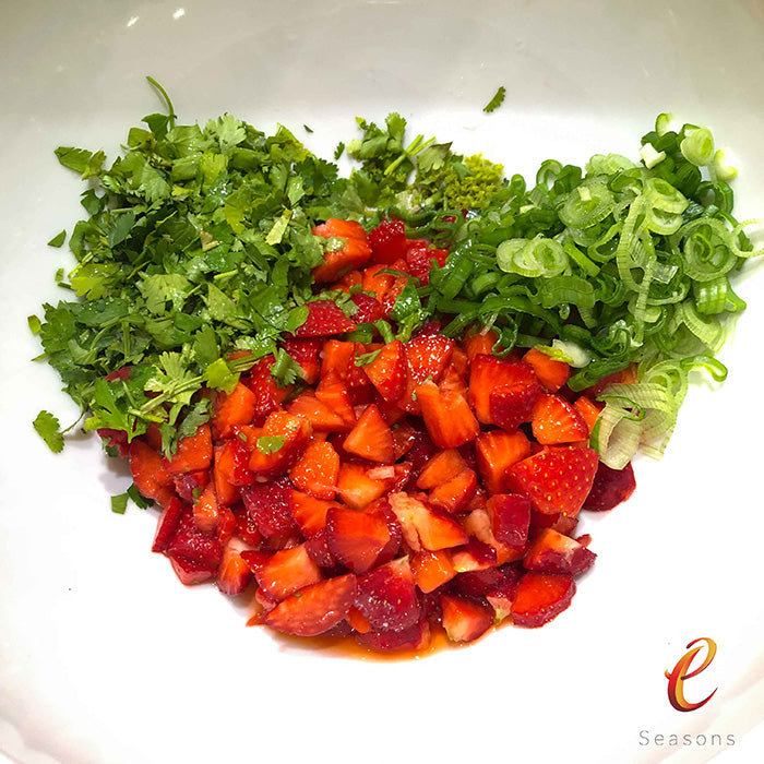  eSeasons Strawberry Season- Salmon & Balsamic Strawberry. Adding ingredients to a bowl for the topping