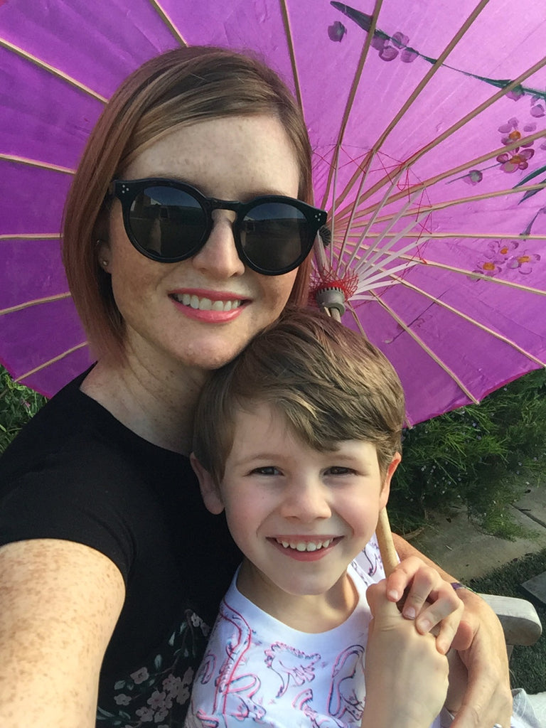 Janna Conner purple parasol and son selfie
