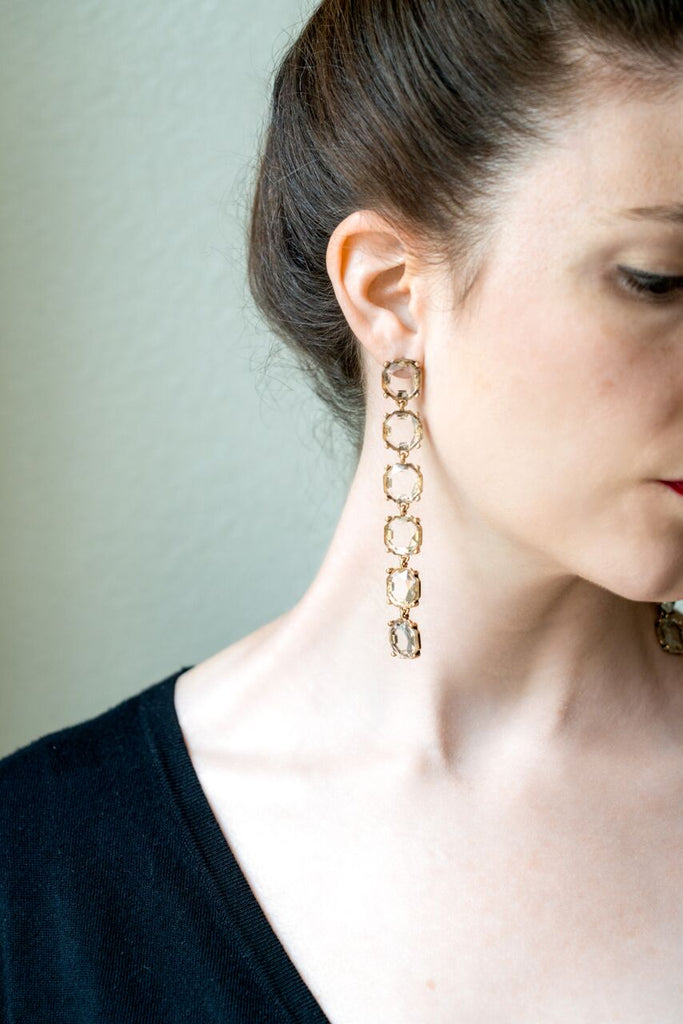 model wearing long shoulder duster crystal drop earrings side view