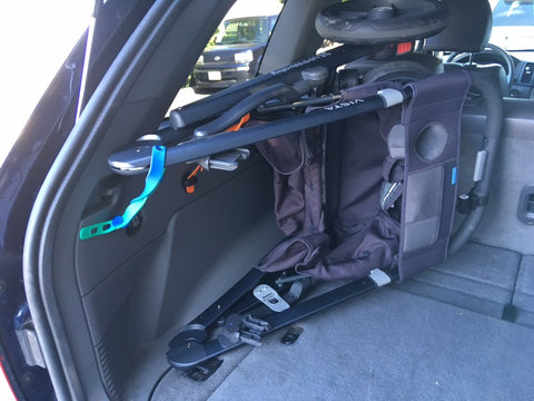 Packbands securing a stroller in a car trunk or SUV