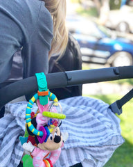 Packbands secures baby products and toys to stroller
