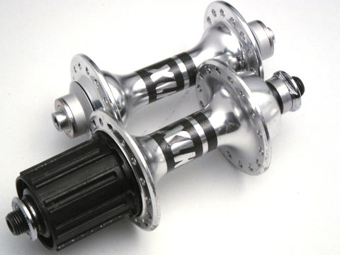 Pic of restored and polished classic bicycle hubs, by XLR8 wheels.