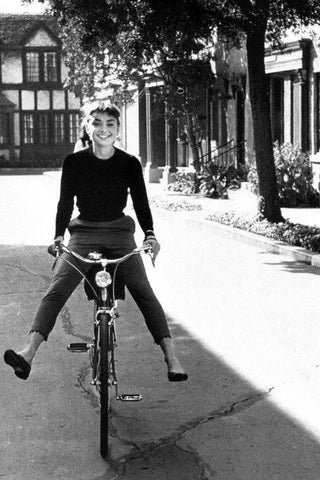 Audrey Hepburn casual 1950s vintage outfit riding bike cigarette slack pants ballet pumps Splendette