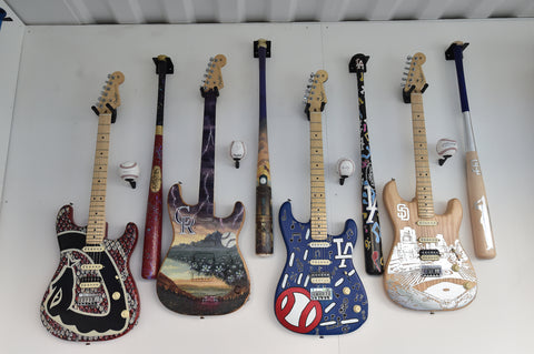 Artist-Painted Louisville Slugger Bat and Fender Guitars