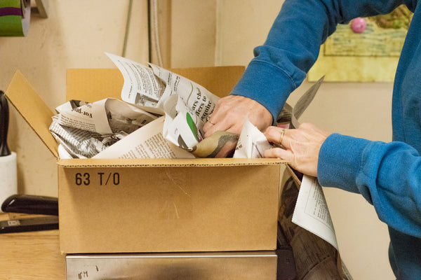 packing a box in a warehouse