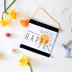 Hand embroidered happy print for a child's bedroom