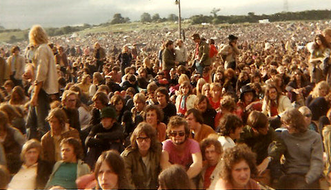 Lots of hairy people in a field. It was a common sight in the 70s.