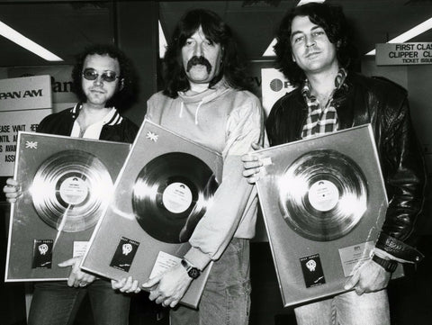 Deep Purple at Heathrow with Perfect Strangers gold discs.