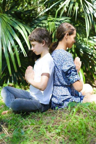 Mother and son meditating