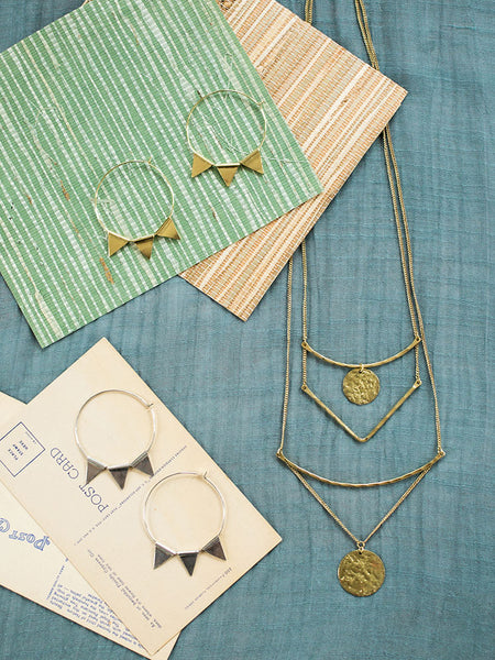 Abaco Hoop Earrings in Gold, Abaco Hoop Earrings in Silver, and Tiered Sundrop Necklace in Gold