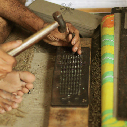 Designing process: Punching of cardboard, in making of Banarasi saree. Weaving Process by Weaver Street