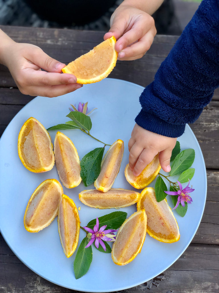 immune boosting recipes by tanya maher _ frozen fruit ice lollies in orange skin wedges