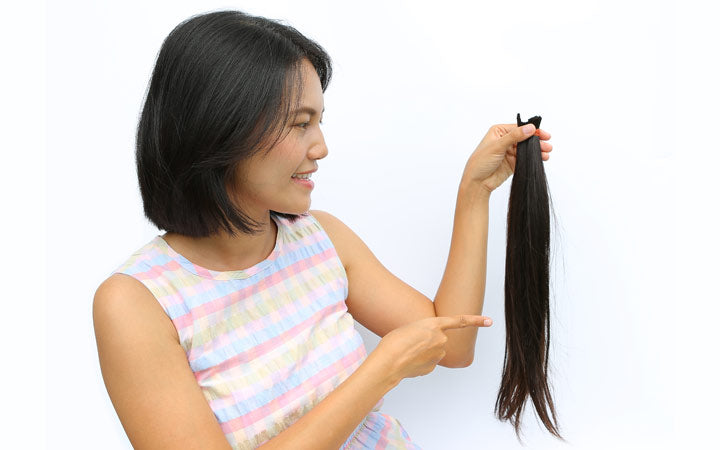 Woman showing cut hair