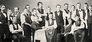 Candy makers of 1874 with founder, George Ziegler (seated left, at table).
