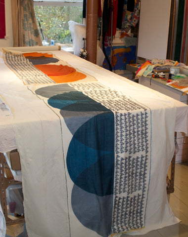 Jane Keith - Cashmere scarves drying after steaming process on table