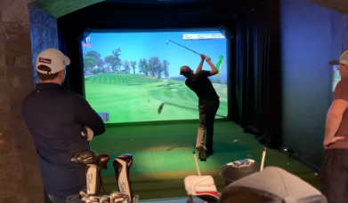 golfers playing on hd golf simulator