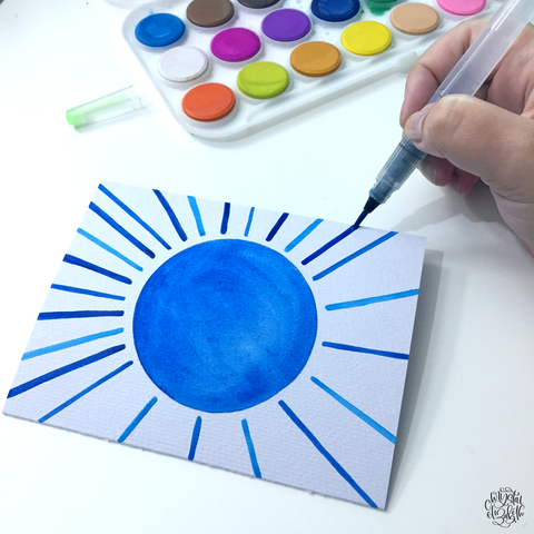 Blue watercolor paint on kassa water paper pad