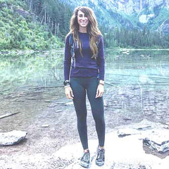 Melissa Urban, Co-Founder of Whole30 wearing a Mindful Mark, standing in front of a lake with a mountain in background.