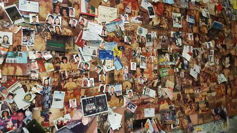 passport photos on the wall